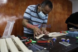 Music teacher designs violin with recycled products
