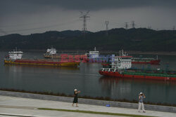 Vessels line up on the Yangtze River to cross the Gezhouba Dam